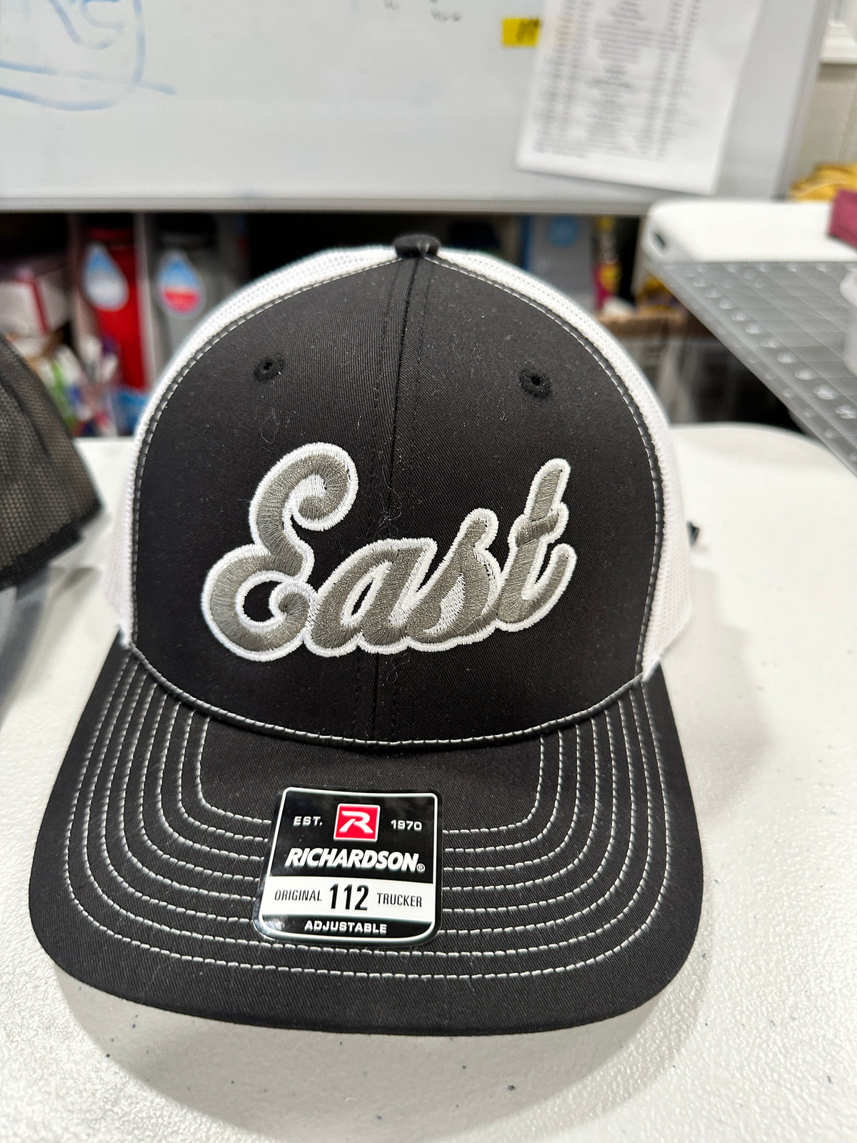 East Embroidered Trucker Hat